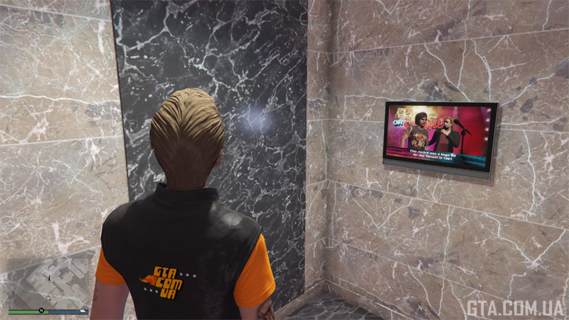 A TV opposite the toilet — every guy’s dream.