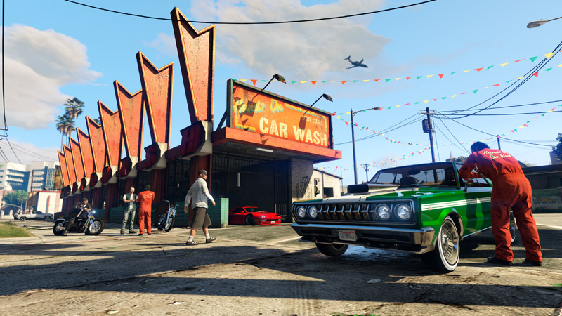 Hands On Car Wash in Strawberry. The screenshot presumably shows new vehicles: the green Declasse Tampa GT and the red Grotti Cheetah Classic Widebody.